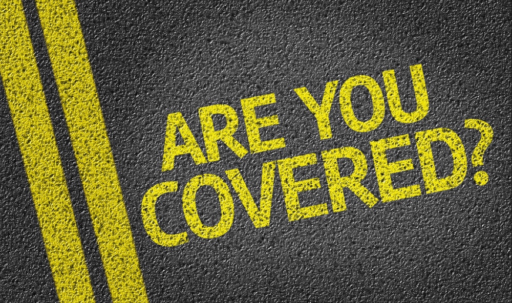 Are you Covered written on the road