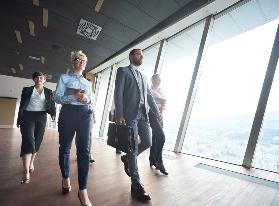 business team, businesspeople  group walking at modern bright office interior-1